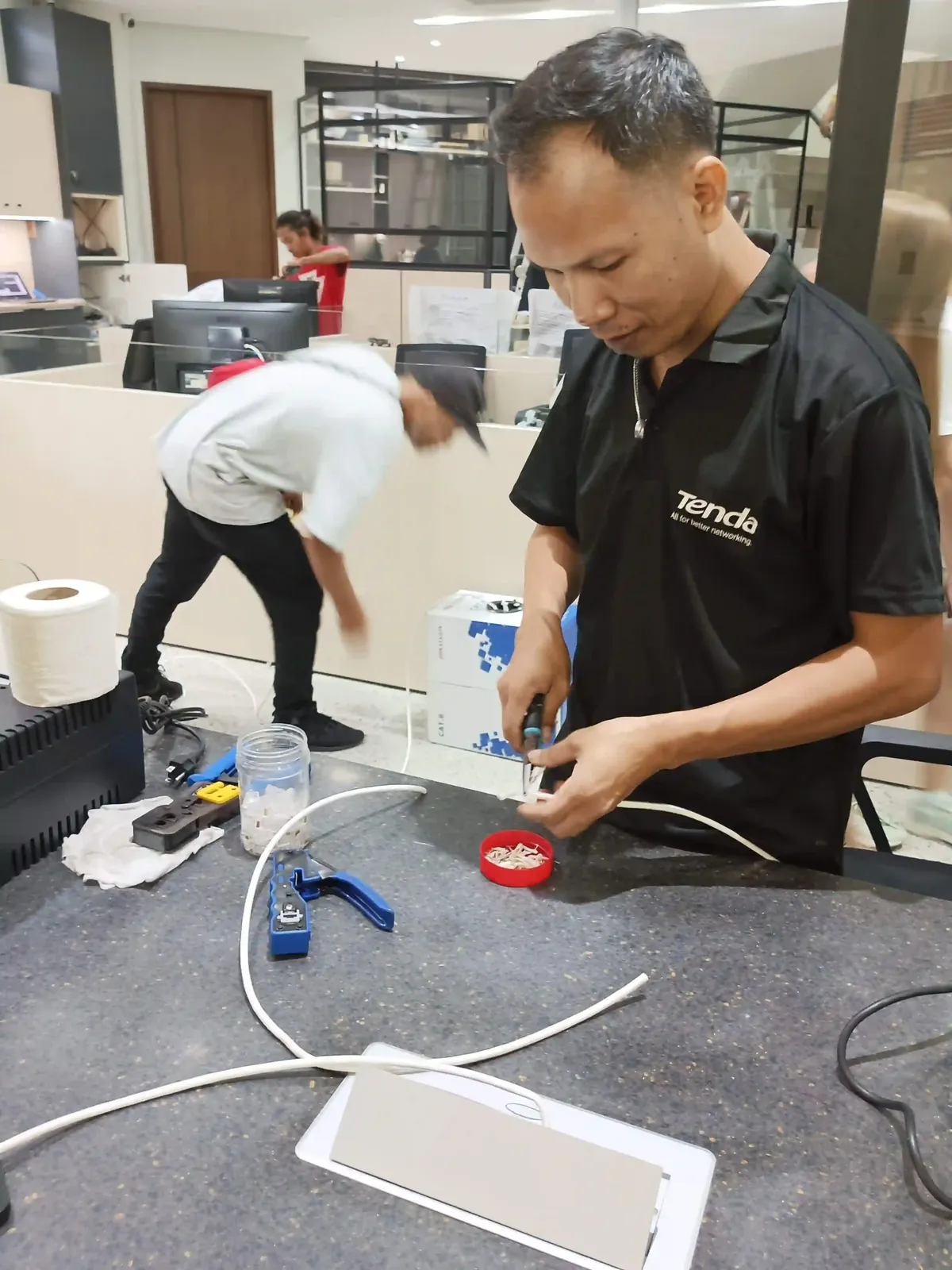 Candid on-site photo of the Powerbyte team at work.