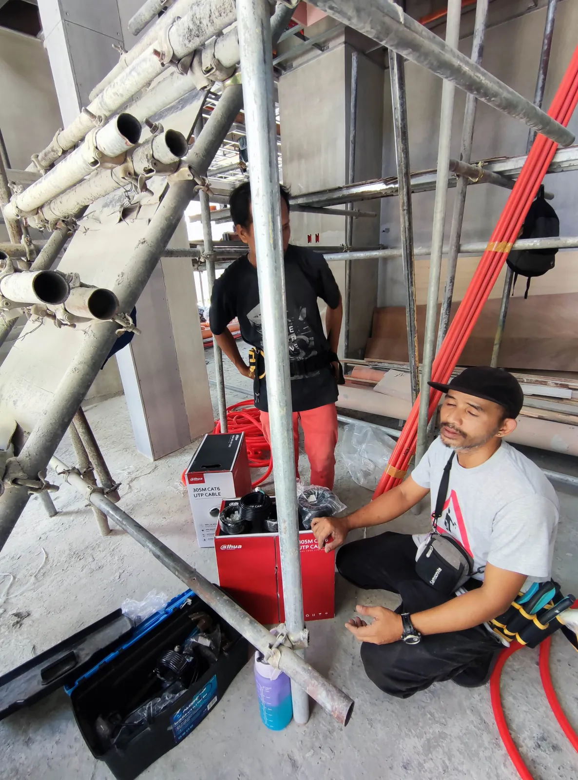 Candid on-site photo of the Powerbyte team at work.
